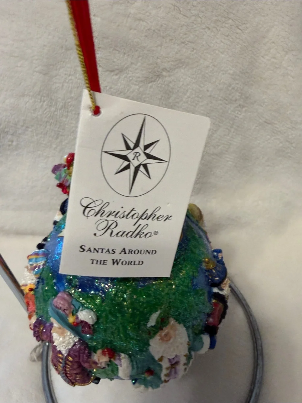 Christopher Radko Santa’s around the world with tag